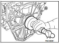  Press in rear oil seal (1) to the position as shown in the figure.