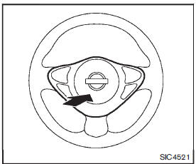 To sound the horn, push the center pad area of the steering wheel.