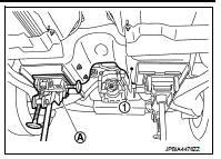 13. Supporting with hands, descend transmission jack carefully, and remove