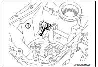 9. Install gear catch, spring, and bushing to transaxle case, and