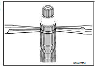 1. Install mainshaft front bearing inner race (1), using the drift (A)