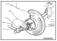 10. Remove strut assembly from steering knuckle. Refer to FSU-10, "Removal