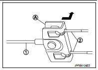 10. Press the pawl (1) to remove the rear cable from the vehicle.
