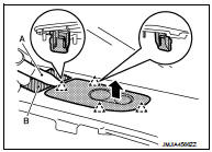 34. Remove instrument panel assembly mounting screws (A) and bolts (B).
