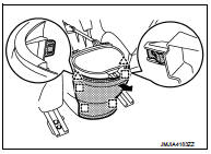 4. Remove center console assembly fixing screws (A).