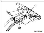 5. Remove grommet on the lower dash, and pull the hood lock control cable