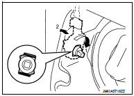 4. Disengage fuel filler lid opener cable (1). Remove fuel filler lid