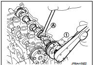 11. Install the camshaft (INT and EXH) to the camshaft sprocket