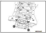 8. When installing the oil pan, ensure that the tabs (D) of the baffle