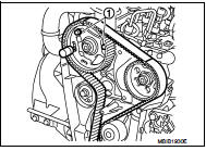 8. Install the timing belt, aligning the marks on the belt with those on the