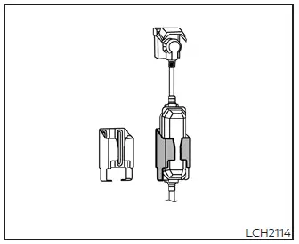 Inserting the Nissan Leaf charge connector into the vehicle port