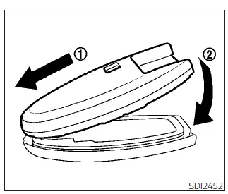 Illustration showing the proper alignment and snapping together of the Nissan Leaf Intelligent Key casing halves after battery replacement