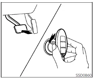 Illustration demonstrating touching the discharged Intelligent Key to the Nissan Leaf power switch button to start the EV system