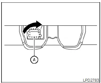 Using a tool to carefully pry open the plastic emergency access cover on the internal tailgate trim panel