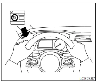 Applying the speed restriction sticker to the Nissan Leaf dashboard for driver awareness