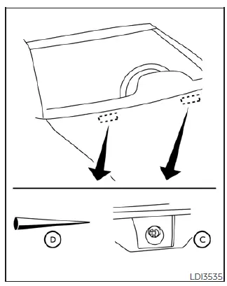 Close-up of the washer fluid nozzle and the tool used for clearing obstructions